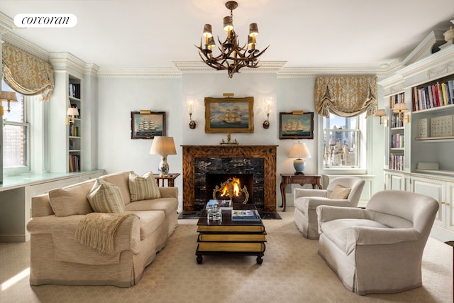 895 Park Ave Phc, Phc, New York City, NY 10075 - living area featuring a high end fireplace, ornamental molding, visible vents, and a notable chandelier