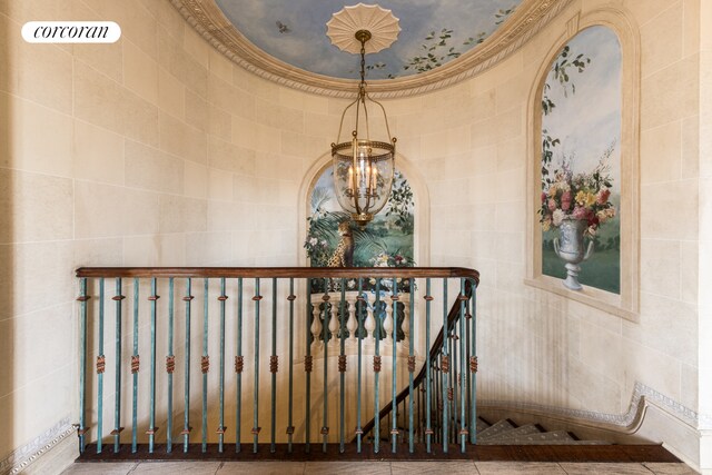 895 Park Ave Phc, Phc, New York City, NY 10075 - stairs featuring tile walls and a chandelier