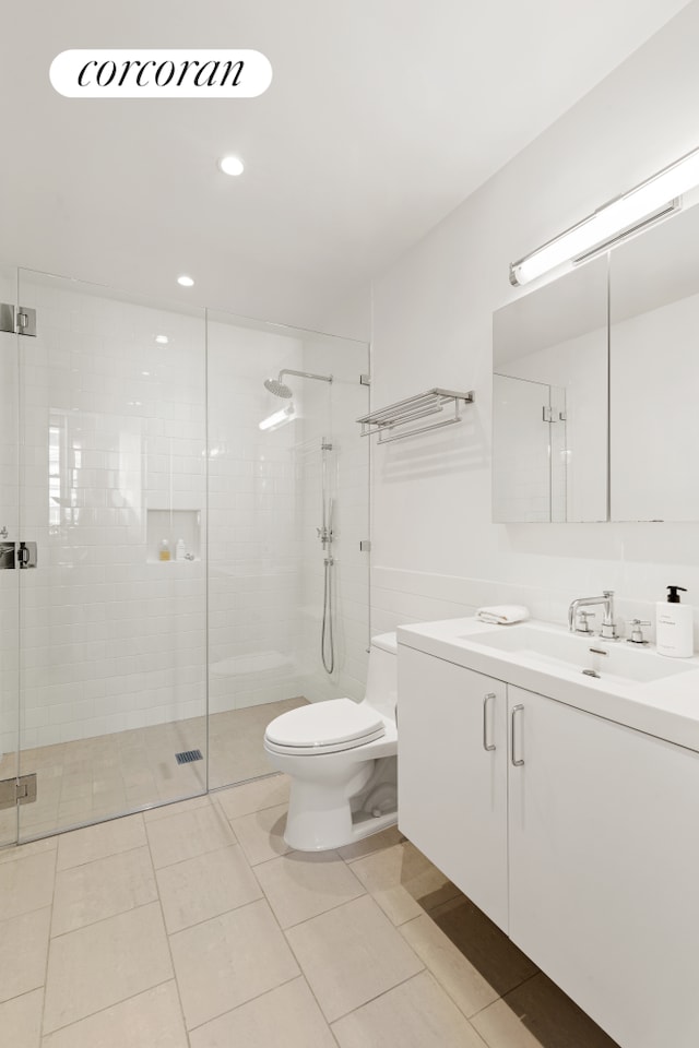 full bathroom with recessed lighting, toilet, a stall shower, vanity, and tile patterned flooring