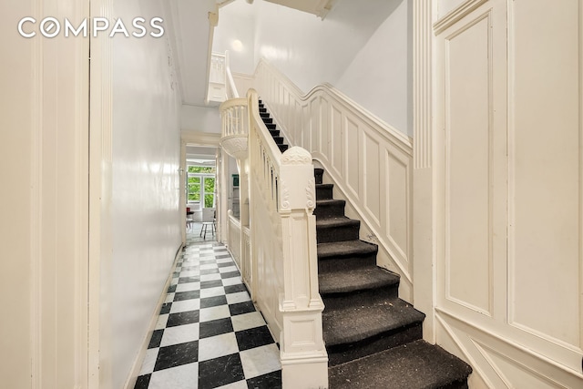 131 W 118th St, New York City, NY 10026 - stairs with tile patterned floors and baseboards