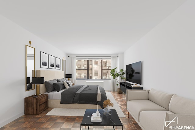 bedroom featuring baseboards