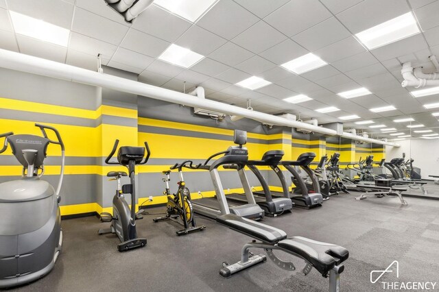 workout area with a drop ceiling