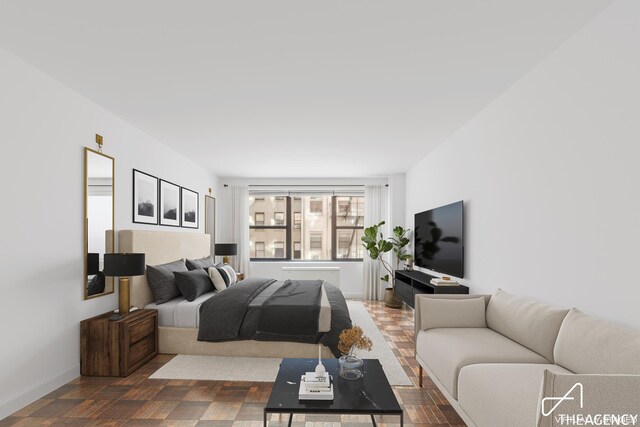 unfurnished room with baseboards