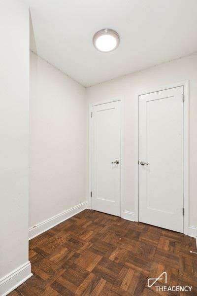 bathroom featuring shower / tub combo with curtain, toilet, tile patterned floors, and vanity