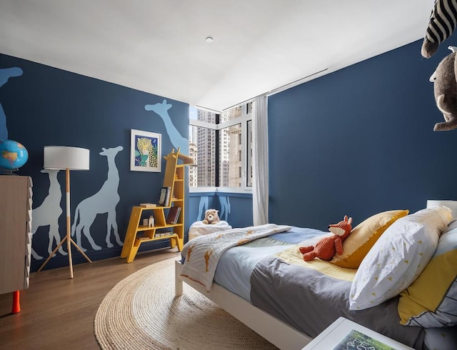 bedroom with hardwood / wood-style flooring