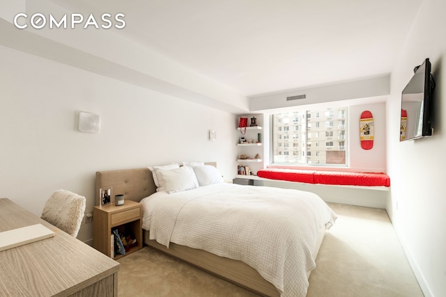 bedroom with light carpet, baseboards, and visible vents