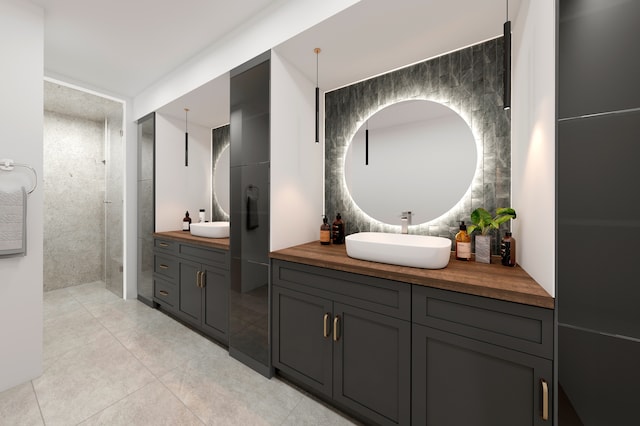 bathroom with vanity, tile patterned flooring, and walk in shower