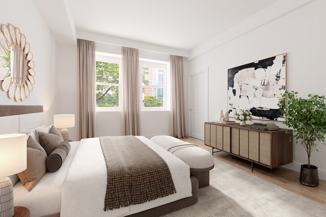 bedroom featuring light wood-style flooring