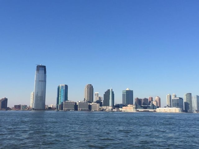 property's view of city featuring a water view