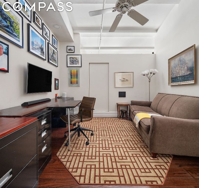 home office with ceiling fan and hardwood / wood-style floors