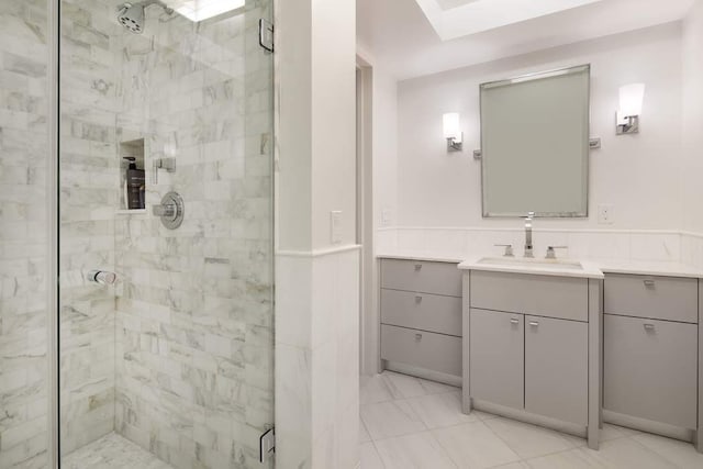 bathroom featuring a stall shower and vanity