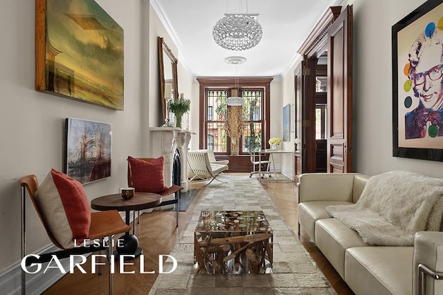 living area featuring ornamental molding, wood-type flooring, and a notable chandelier