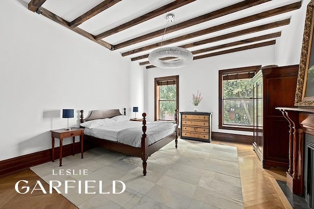 bedroom featuring beamed ceiling