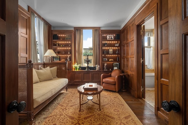 sitting room featuring dark hardwood / wood-style flooring