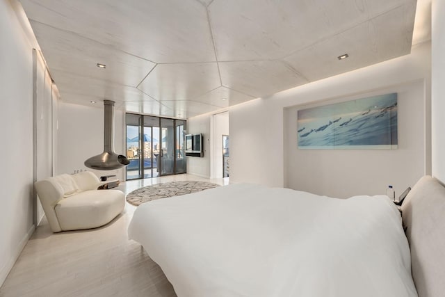 bedroom featuring access to outside and light wood-type flooring