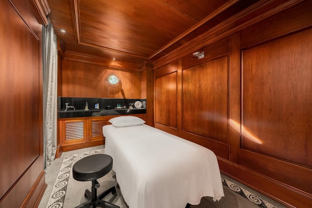 bedroom with ornamental molding, wooden ceiling, and wooden walls