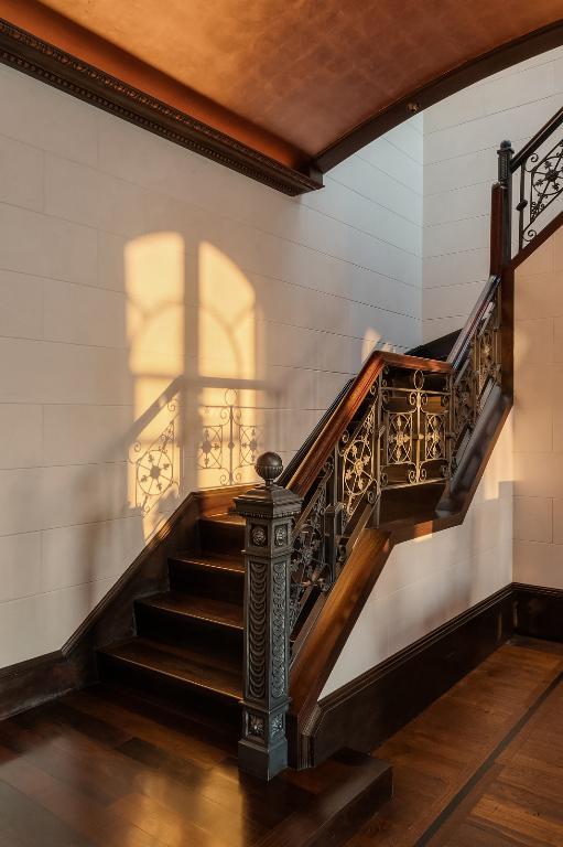 stairway featuring wood-type flooring