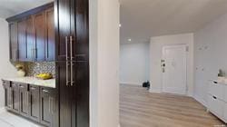 interior space featuring dark brown cabinets and light wood-type flooring