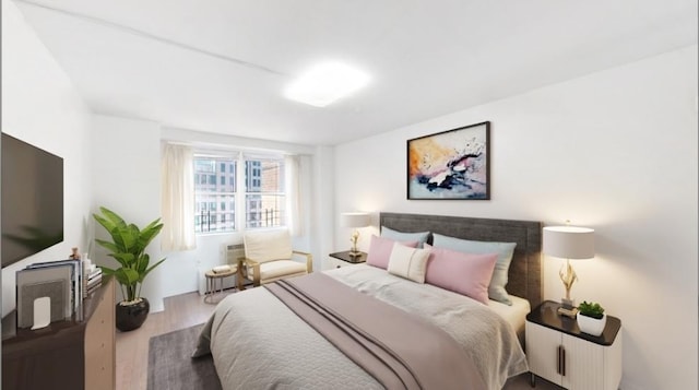 bedroom with wood finished floors