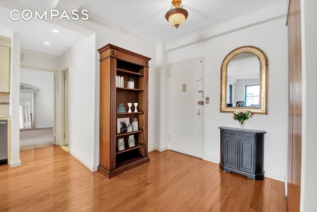 entrance foyer featuring recessed lighting, light wood-type flooring, and baseboards