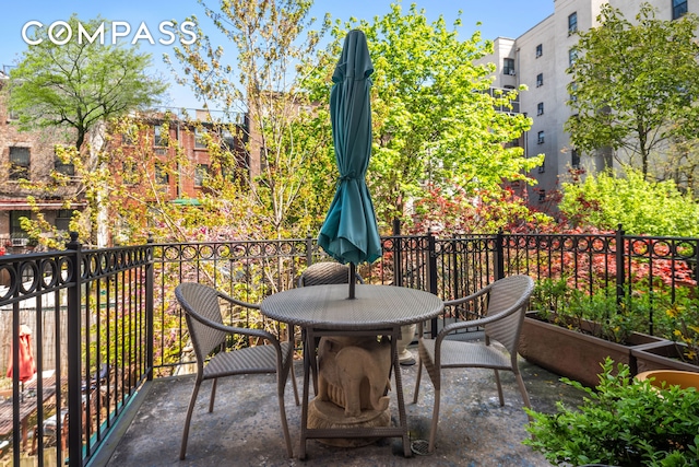 balcony with outdoor dining area