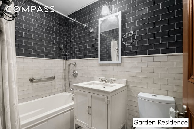 full bathroom featuring toilet, tile walls, vanity, and shower / bath combo with shower curtain