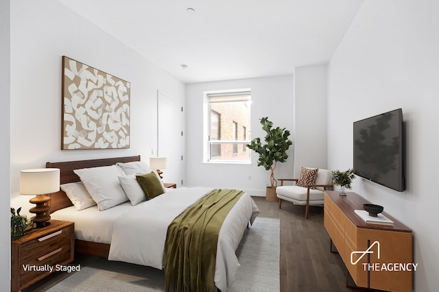 bedroom with dark wood-style floors