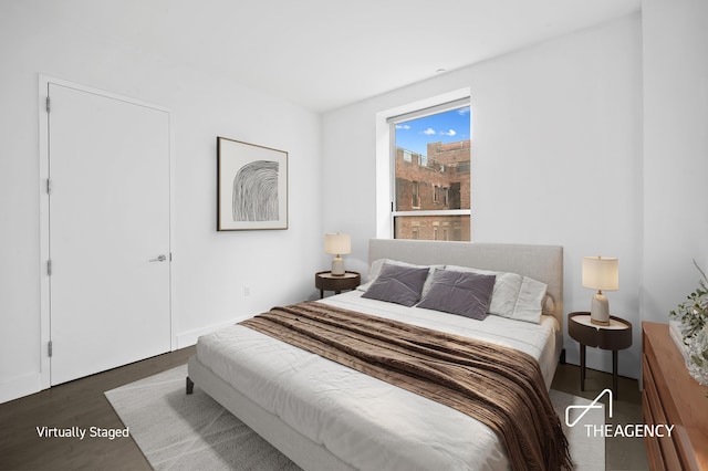 bedroom featuring wood finished floors