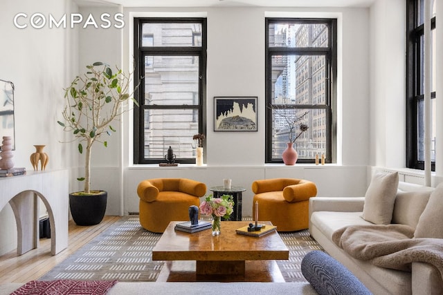 sitting room with hardwood / wood-style flooring