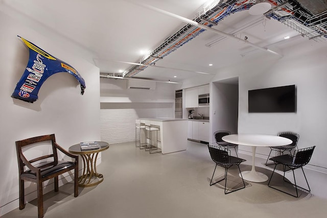 169 Hudson St Unit 1-N, New York City, NY 10013 - dining space featuring concrete flooring and an AC wall unit