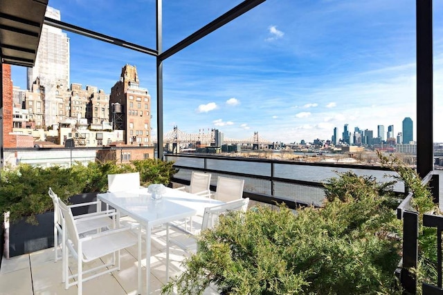 balcony with a view of city and a water view