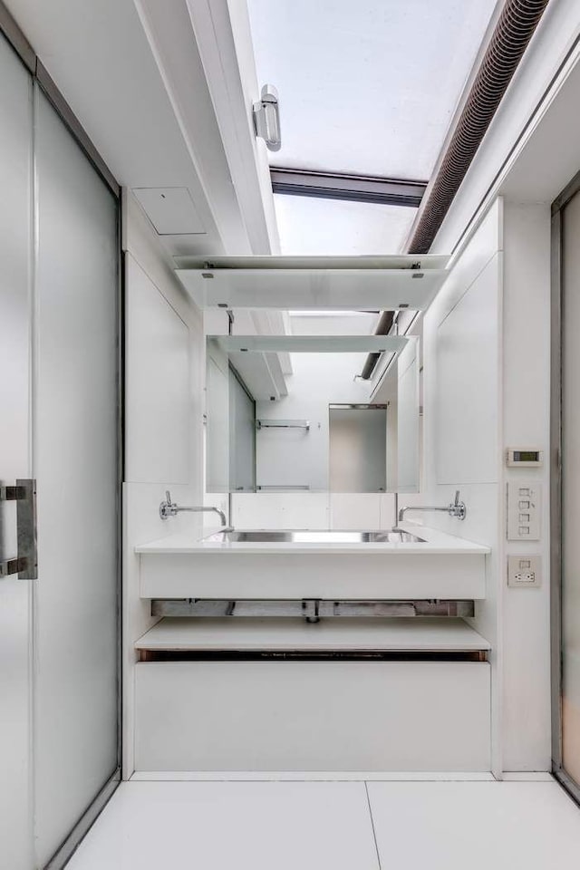 bathroom featuring double vanity