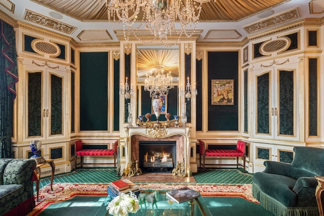 living area featuring a premium fireplace and a notable chandelier