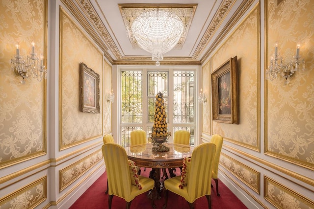 dining area featuring ornamental molding and an inviting chandelier