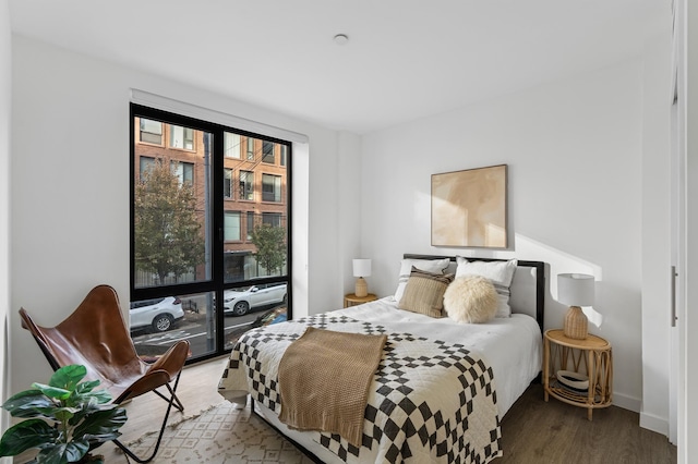 bedroom with wood finished floors