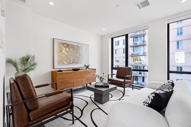 sitting room featuring recessed lighting, visible vents, and light wood-style flooring