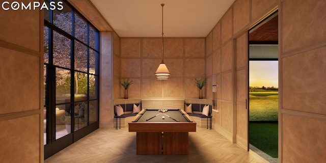 recreation room with a high ceiling, billiards, and a healthy amount of sunlight