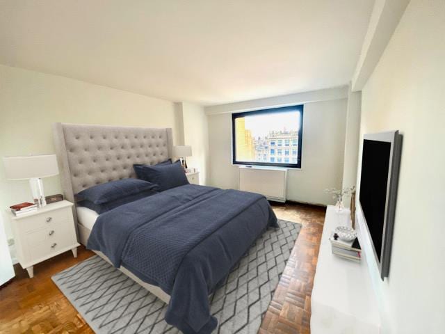 bedroom with radiator heating unit