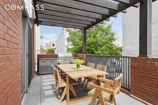 balcony with outdoor dining space and area for grilling