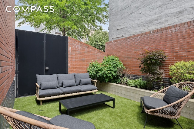 view of patio with an outdoor living space and fence