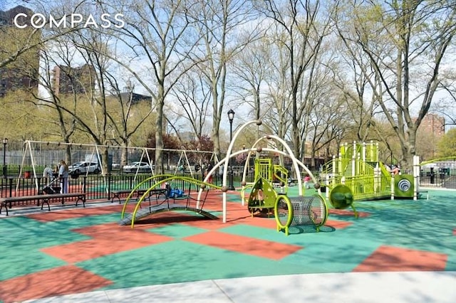 community jungle gym featuring fence