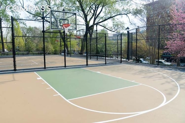 view of sport court featuring community basketball court and fence