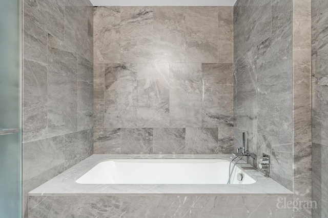 bathroom with a garden tub