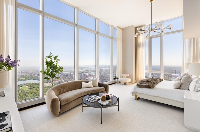 bedroom featuring an inviting chandelier, multiple windows, and floor to ceiling windows