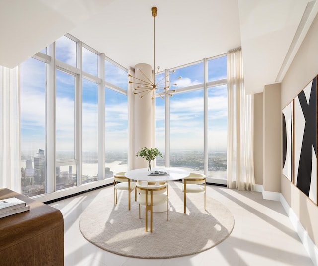 dining area featuring baseboards, a water view, a view of city, floor to ceiling windows, and a notable chandelier