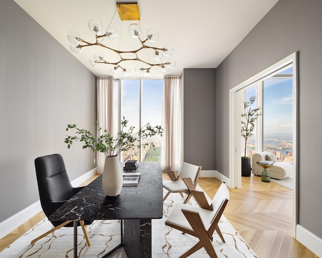 dining area with a notable chandelier and baseboards