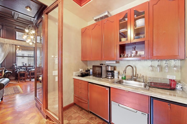 205 W 57th St Unit 4-Aa, New York City, NY 10019 - kitchen featuring light countertops, glass insert cabinets, and a chandelier