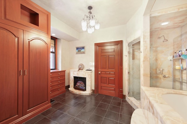 205 W 57th St Unit 4-Aa, New York City, NY 10019 - full bathroom featuring tile patterned flooring, a marble finish shower, a fireplace, a bath, and a chandelier
