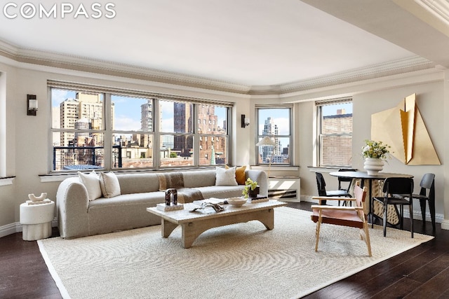 living room featuring a wealth of natural light, ornamental molding, and hardwood / wood-style floors