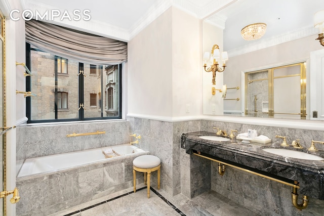 bathroom with crown molding, a bath, double vanity, and a sink